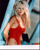 Pamela Anderson Baywatch photo print in swimsuit relaxing in bed.