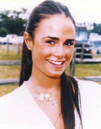 Close up portrait photo print of Jordana Brewster in a white tunic and crucifix necklace