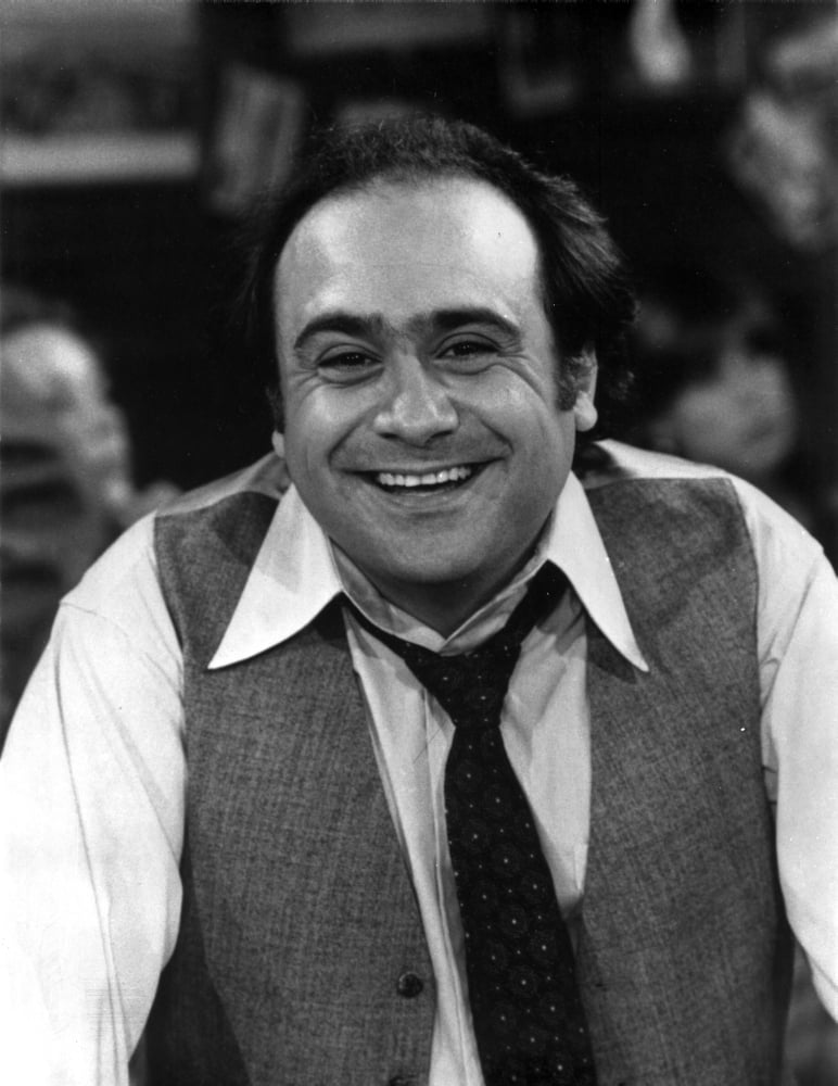 Danny DeVito smiling photo print, available in various sizes.