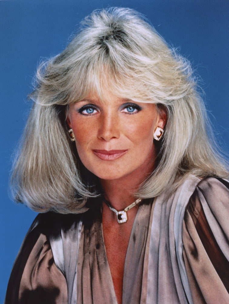 Close-up portrait photo print of Linda Evans against a blue background