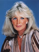 Close-up portrait photo print of Linda Evans against a blue background