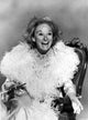 Phyllis Diller seated classic photo print, capturing her iconic charm.