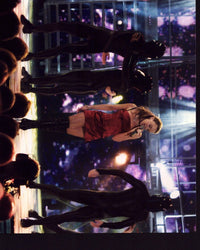 Kylie Minogue singing on stage in a red silk dress photo print.
