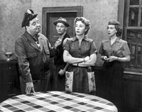 Honeymooners photo print featuring lady crossing arms and sheriff talking.