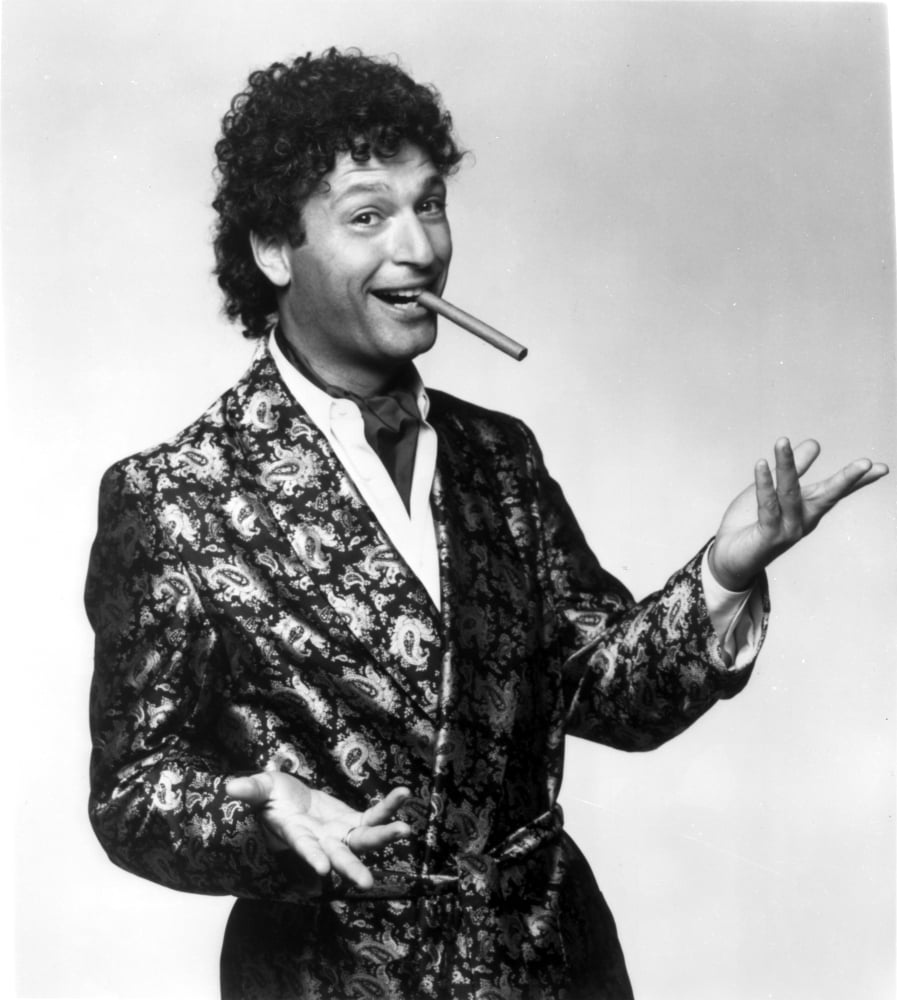 Howie Mandel smoking a cigar photo print, available in multiple sizes.