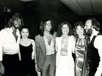 Candid group photo print of the Bee Gees, showcasing their iconic style.