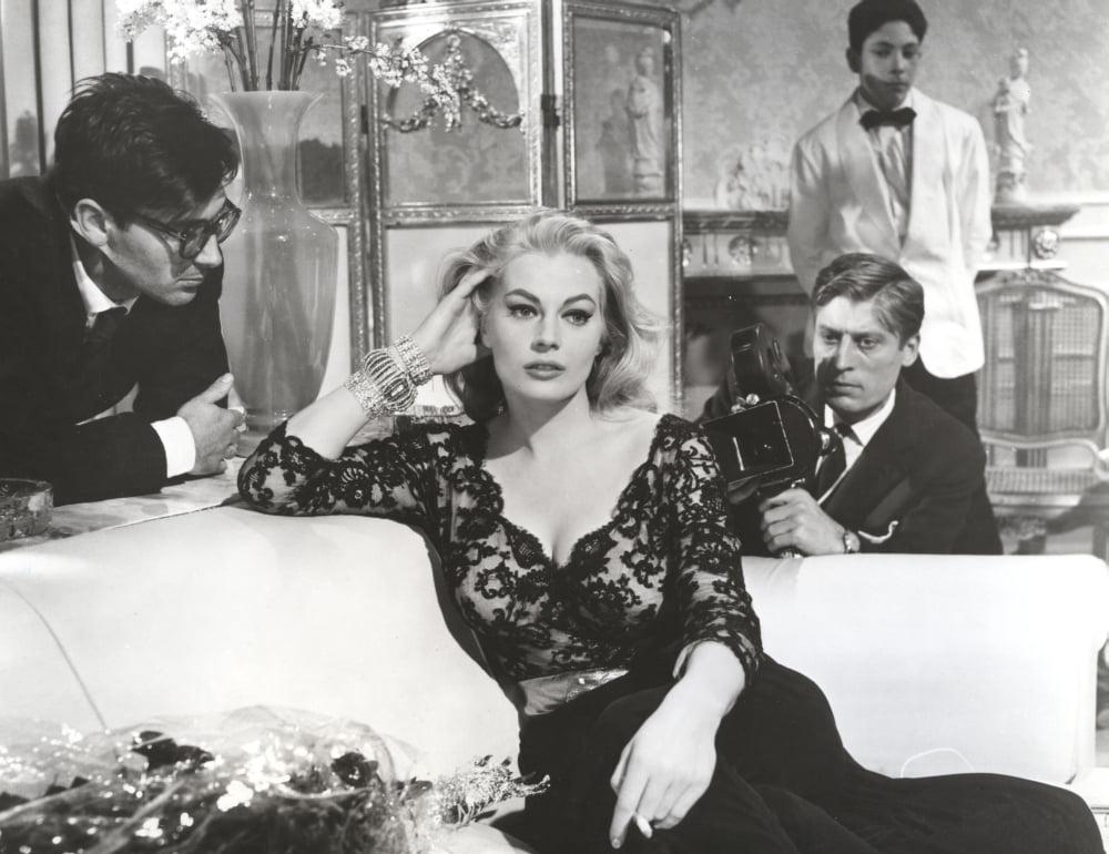 Classic portrait photo print of Anita Ekberg sitting on a couch.