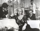 Classic portrait photo print of Anita Ekberg sitting on a couch.