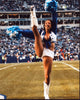 Micaela Johnson Cheering and Kicking Photo Print, vibrant sports photography.