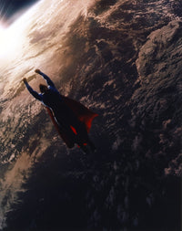 Brandon Routh flying as Superman photo print, dynamic superhero action shot.