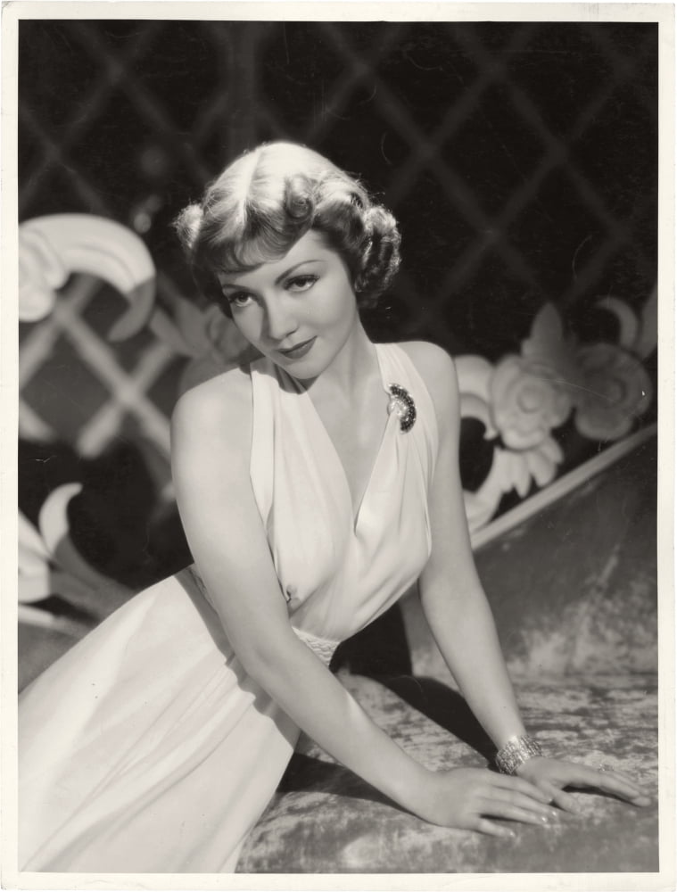 Claudette Colbert posed photo print showcasing classic Hollywood beauty.