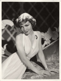 Claudette Colbert posed photo print showcasing classic Hollywood beauty.