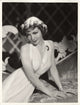 Claudette Colbert posed photo print showcasing classic Hollywood beauty.