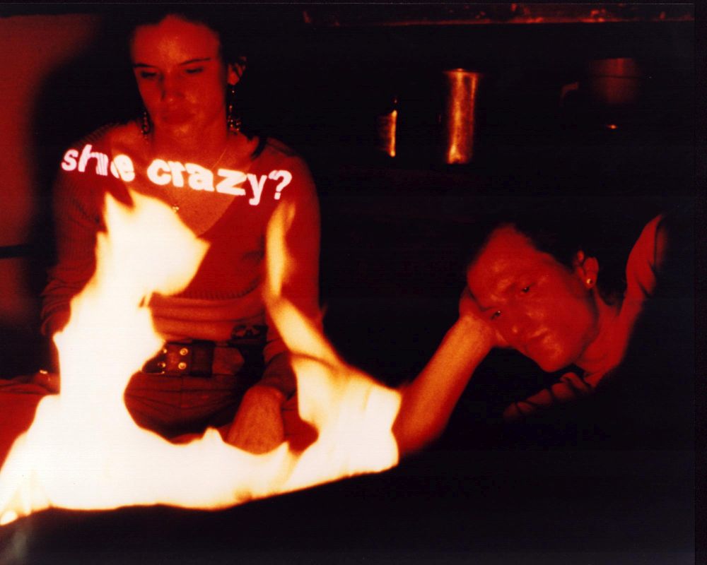 Juliette Lewis and Woody Harrelson sitting by a fire in Natural Born Killers photo print.
