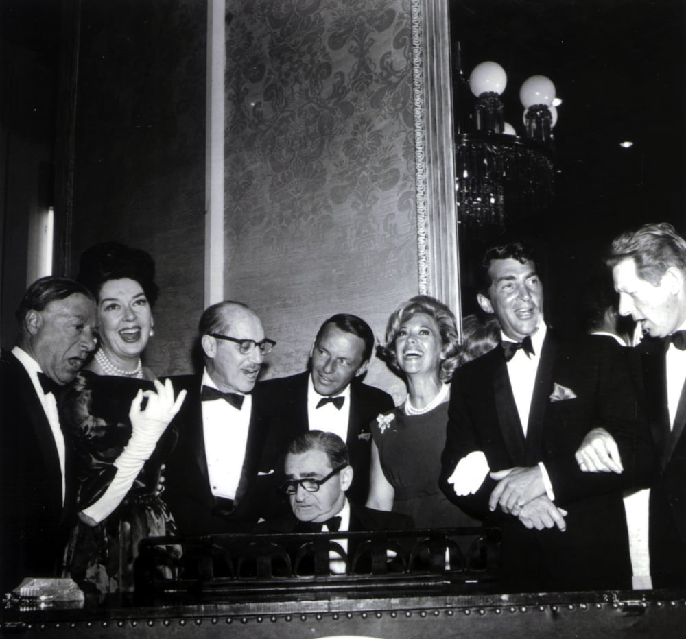Frank Sinatra posing with a group of people photo print