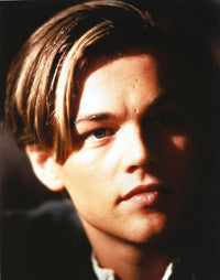 Close-up portrait photo print of Leonardo DiCaprio against a black background.