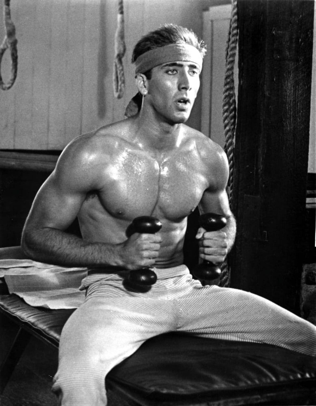 Nicolas Cage working out in a gym photo print.