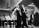 Fred Astaire and Ginger Rogers walking in front of orchestra photo print