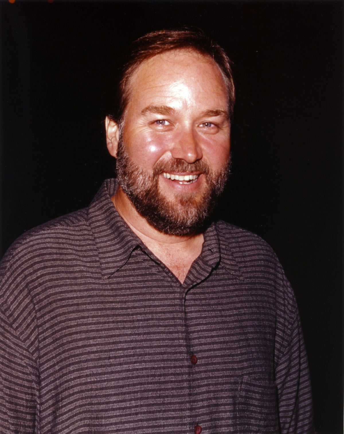 Richard Karn smiling in black shirt photo print