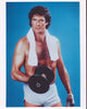 David Hasselhoff lifting weights photo print in vibrant colors.