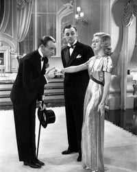 Fred Astaire and Ginger Rogers kissing photo print in classic Hollywood style.