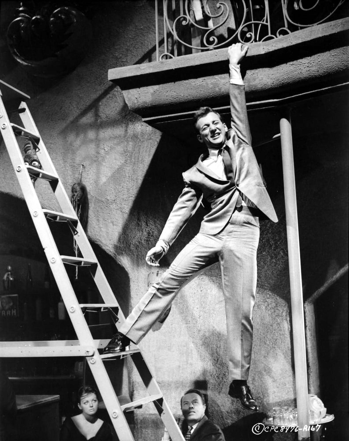 Bobby Darin hanging from a balcony photo print