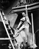Bobby Darin hanging from a balcony photo print