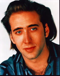 Close-up photo print of Nicolas Cage in blue striped shirt.