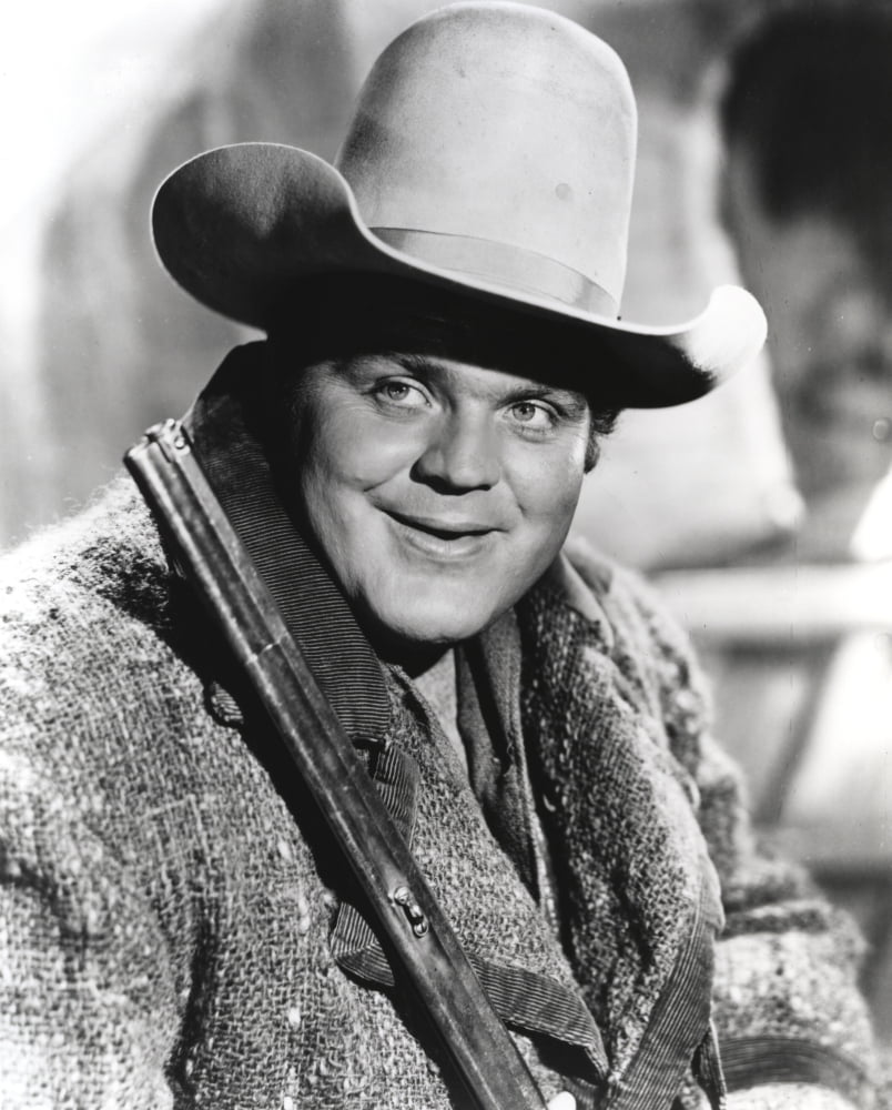 Black and white Bonanza cowboy portrait photo print featuring a cowboy in outfit with rifle.