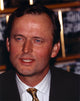 John Grisham portrait photo print in black coat, available in multiple sizes.