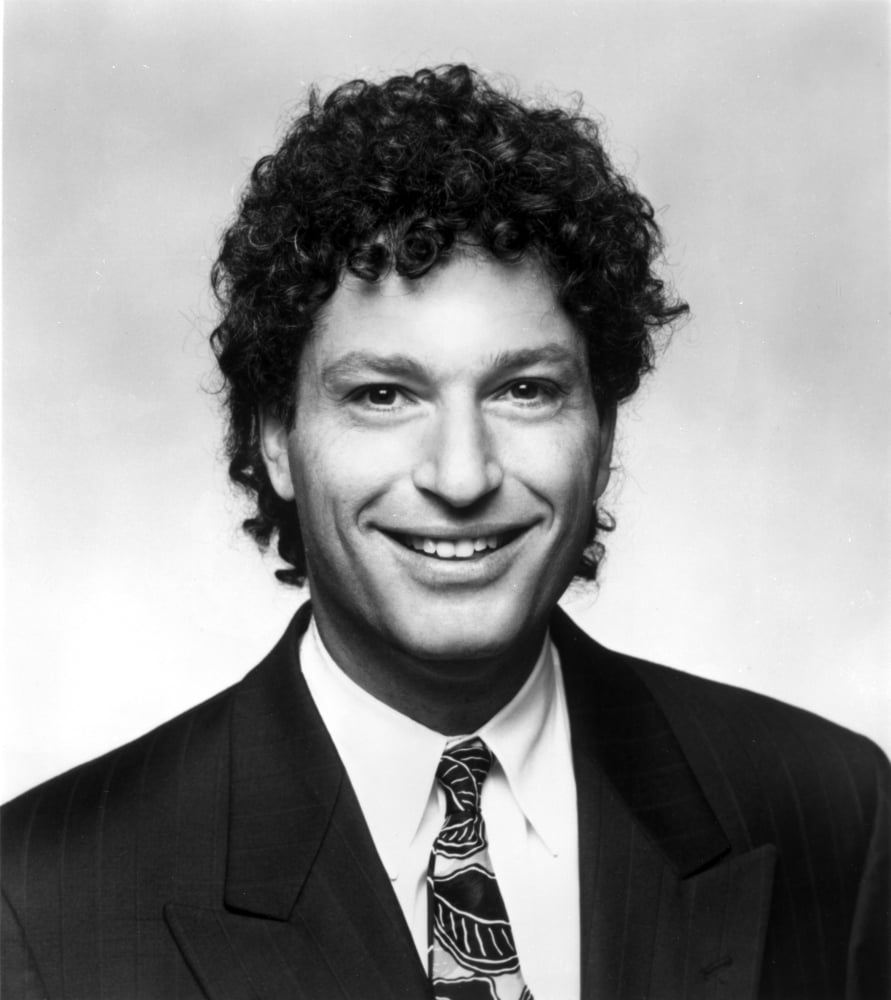 Howie Mandel smiling photo print in vibrant colors, perfect for home or office decor.