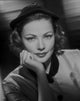 Gene Tierney smiling in shadows photo print in classic style.