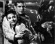 Audrey Hepburn and George Peppard in the rain scene from Breakfast at Tiffany's photo print
