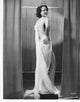 Elizabeth Allen wearing white drape holding hip photo print