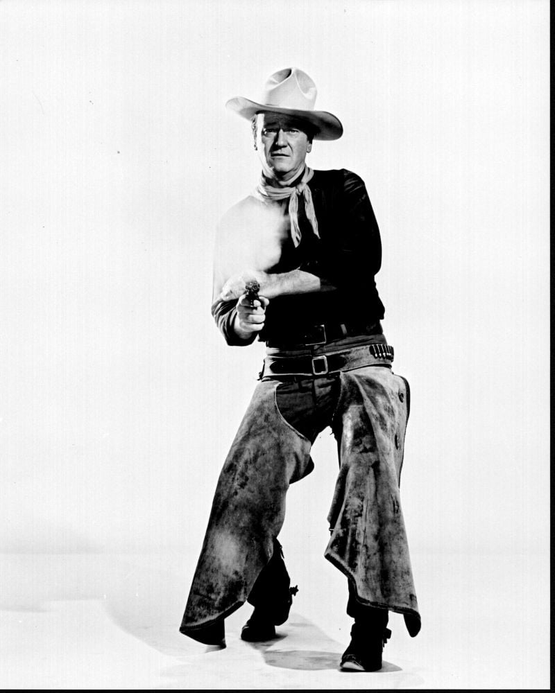 Black and white photo print of John Wayne posed shooting from The Man Who Shot Liberty Valance.