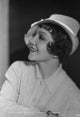 Claudette Colbert side view photo print in white polo shirt and hat