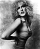 Bette Midler leaning forward portrait photo print in tube dress.