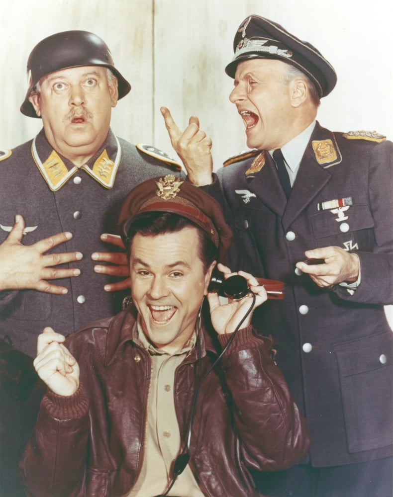 Hogan's Heroes photo print of a man in leather jacket with soldiers.
