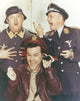 Hogan's Heroes photo print of a man in leather jacket with soldiers.