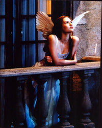 Claire Danes as Juliet wearing wings on balcony in Romeo + Juliet photo print