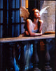Claire Danes as Juliet wearing wings on balcony in Romeo + Juliet photo print