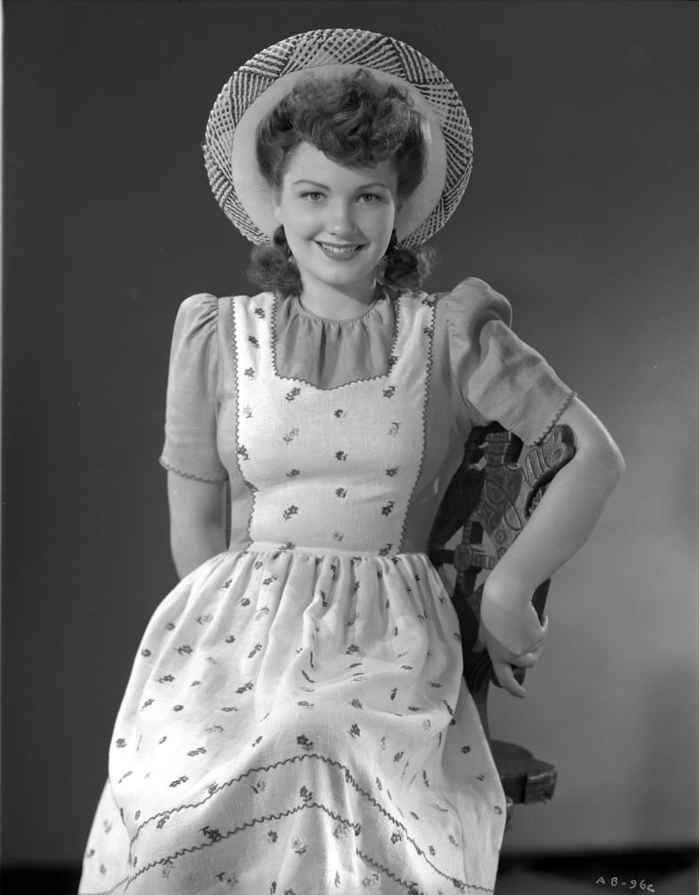 Anne Baxter smiling posed photo print showcasing classic Hollywood charm.