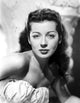 Elegant posed portrait of Gail Russell in white vintage photo print.