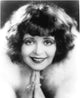 Clara Bow smiling photo print capturing vintage Hollywood charm.