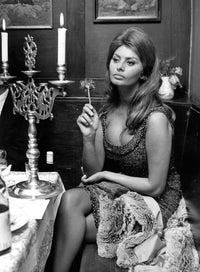 Sophia Loren sitting at a table classic photo print