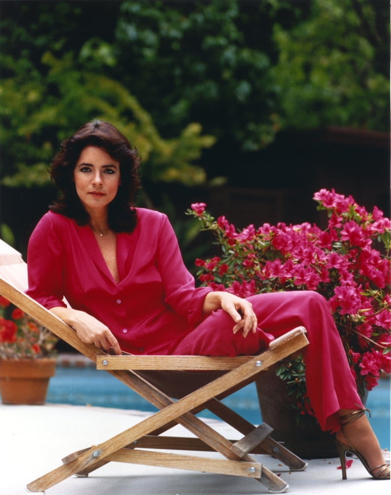Stockard Channing seated elegantly in a red dress photo print