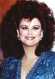 Delta Burke smiling in a glittery dress photo print