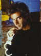 David Copperfield holding handcuffs photo print in black shirt