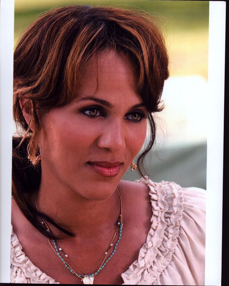 Close-up photo print of Nicole Ari Parker in a white ruffle top.