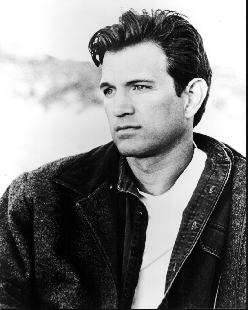 Black and white photo print of Chris Isaak in denim shirt and jacket